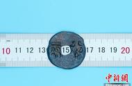 广西首次发现战国秦半两钱币的考古奇迹